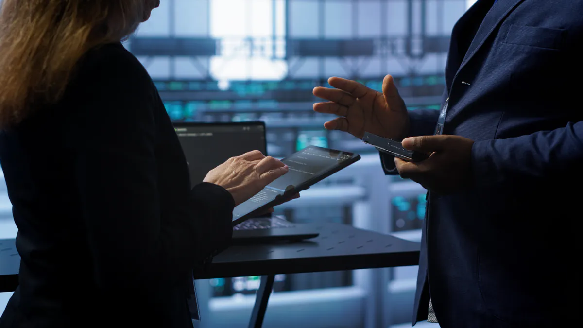 Professionals assessing a technology and operational environment